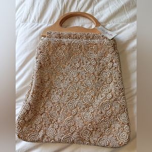 NWT. Gold floral lace bag with wood handles